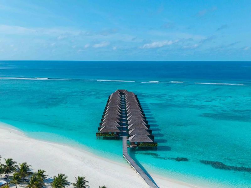 A row of overwater villas off the beach