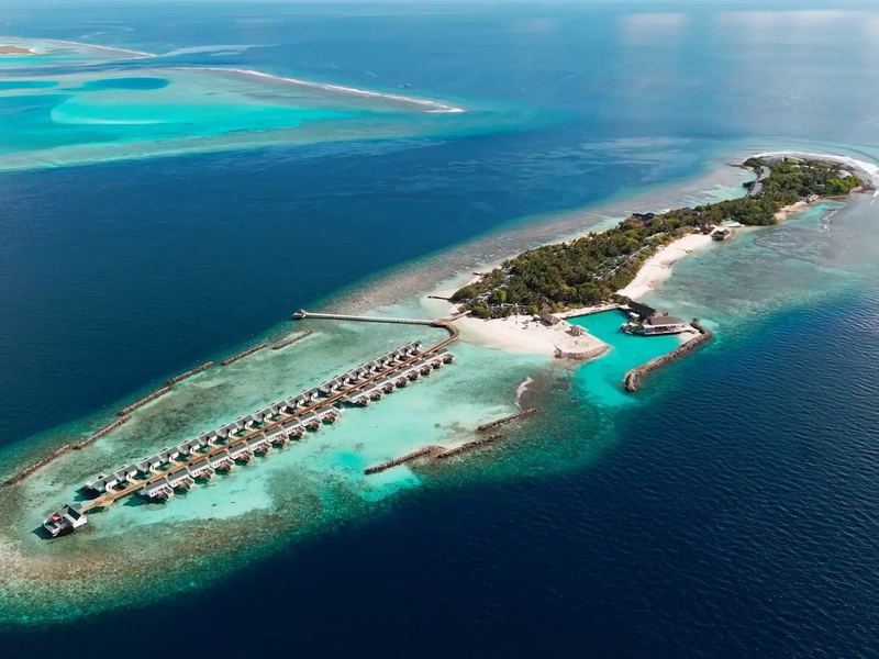 The island and its overwater villas, from the air
