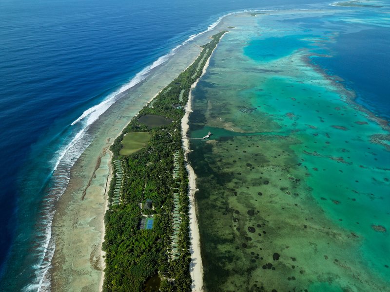 The long, narrow island and its reef, from high above