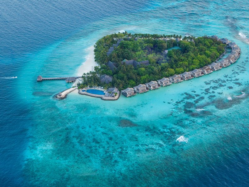 The heart-shaped island and its water villas, from the air