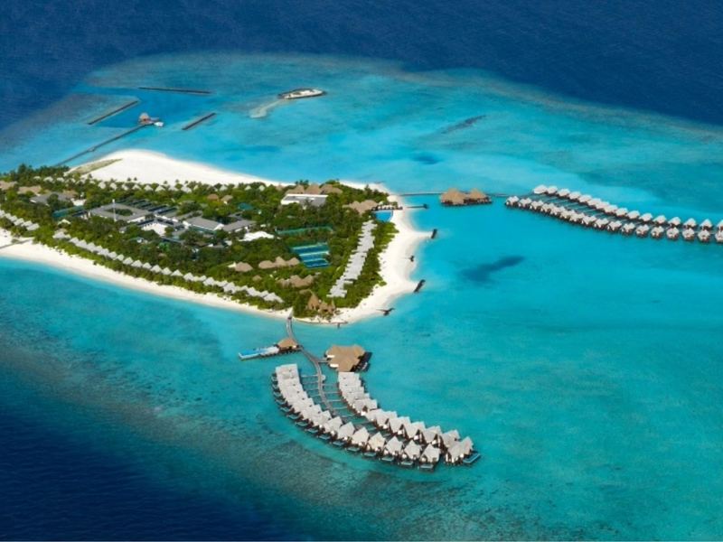 The island and its overwater villas, from the air