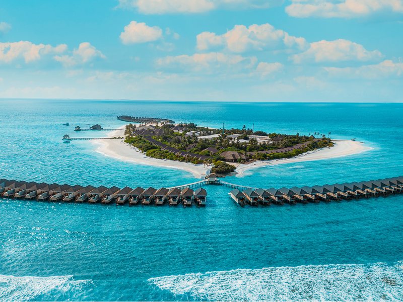The island and its two long wings of water villas