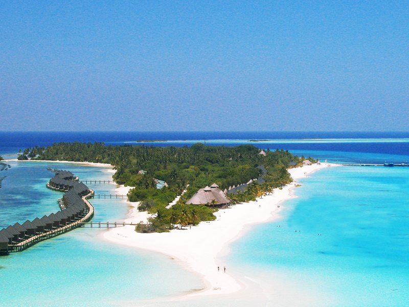 The long island, its water villas and sandbank, from the air