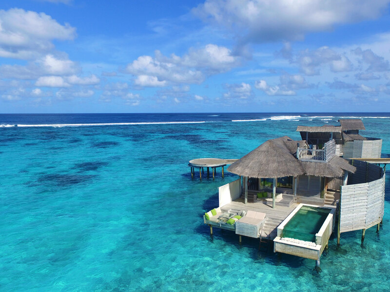 An overwater villa with its own pool, on a turquoise lagoon