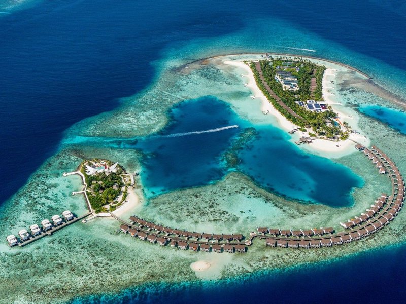 The two islands and their arcs of overwater villas, from high above
