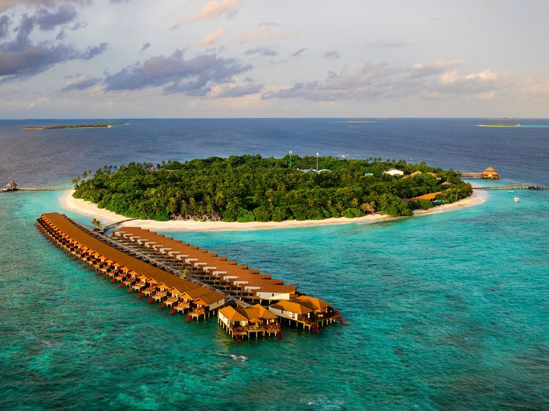 The island and its double row of water villas, from the air