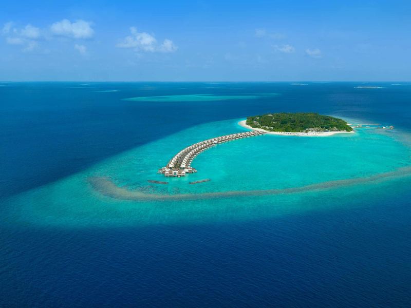 The island and its overwater villas, from the air