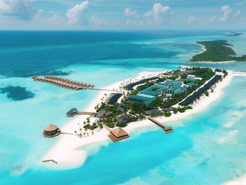 The island with its villas and jetties, from the air
