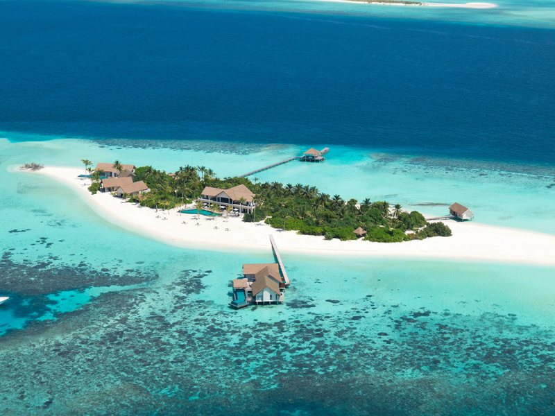The private island, its beach and lagoon, from the air