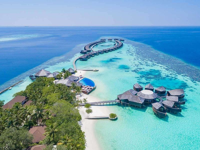Overwater villas and a pool, from the air