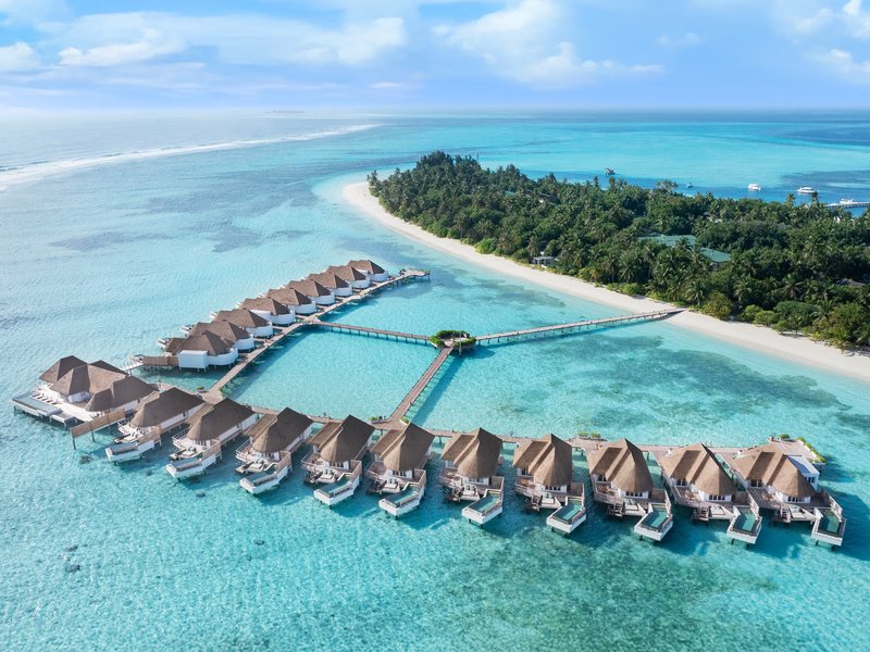 Overwater villas off the island’s beach, from the air