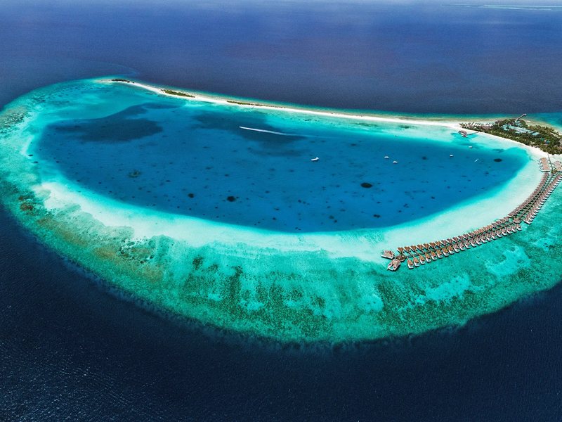 The island at the tip of its ring reef, from high above