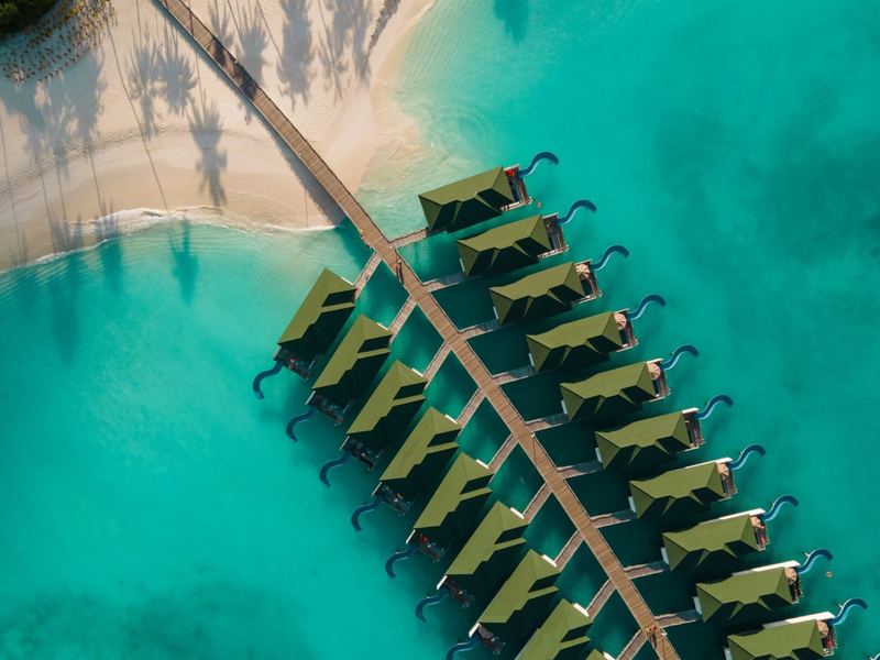 Overwater villas along a jetty, from above